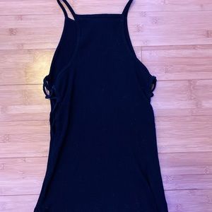 Black spaghetti strap top with side cut outs.